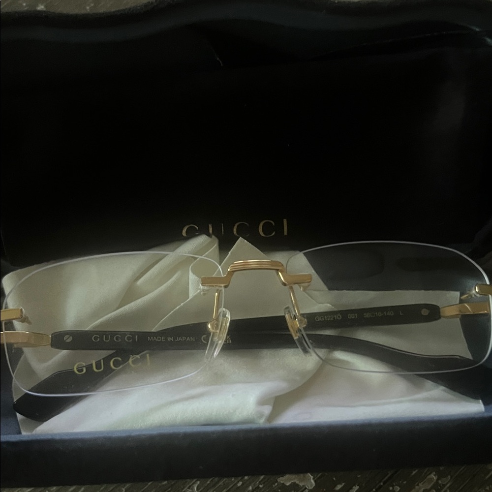 Gucci Rimless Glasses with Gold and Black Accents
